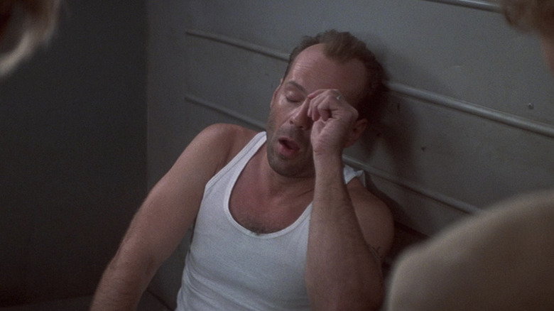 Bruce Willis yawns as John McClane in Die Hard with a Vengeance