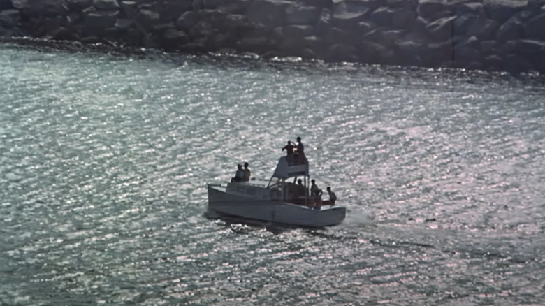 The S S Minnow sails out of a marina in Gilligan's Island