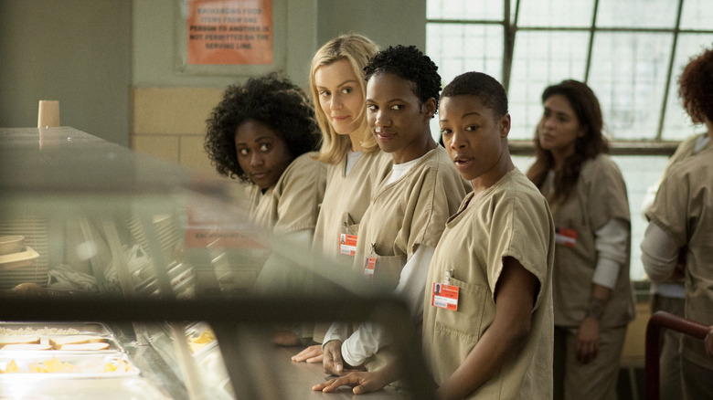 The cast of Orange is the New Black at the lunch line in prison