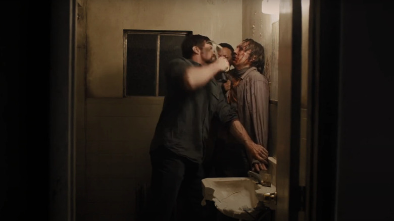 Hugh Jackman's Keller Dover holds a hammer to Paul Dano's Alex Jones' face in the bathroom in 