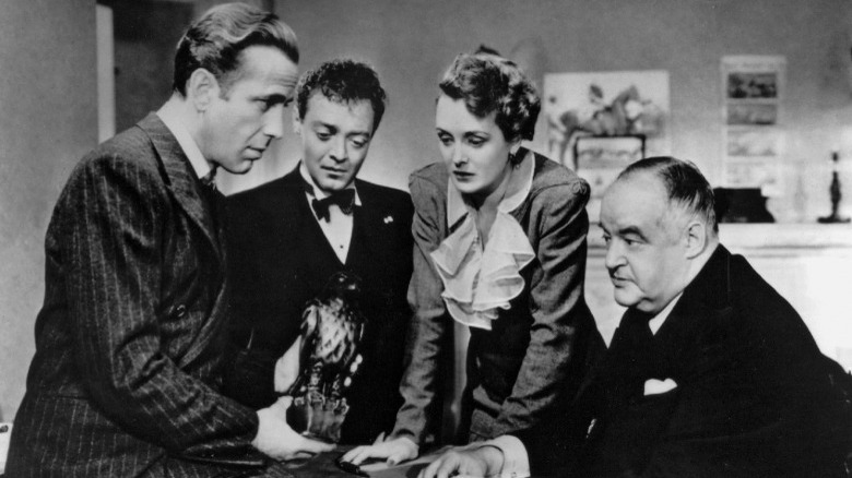 Humphrey Bogart holding the Maltese Falcon