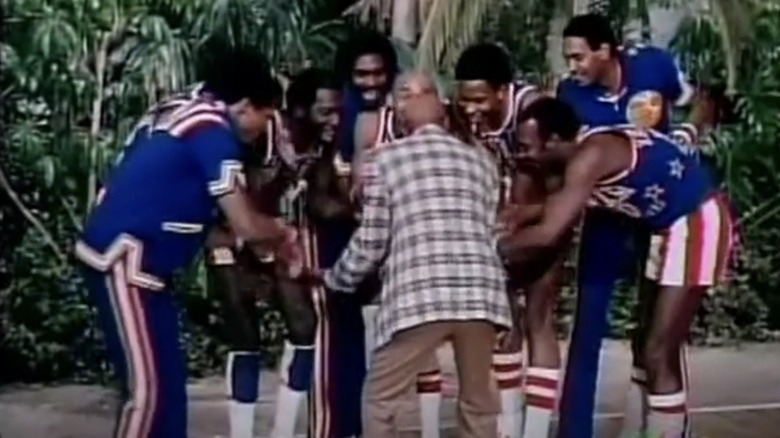 The Harlem Globetrotters huddle up in The Harlem Globetrotters on Gilligan's Island