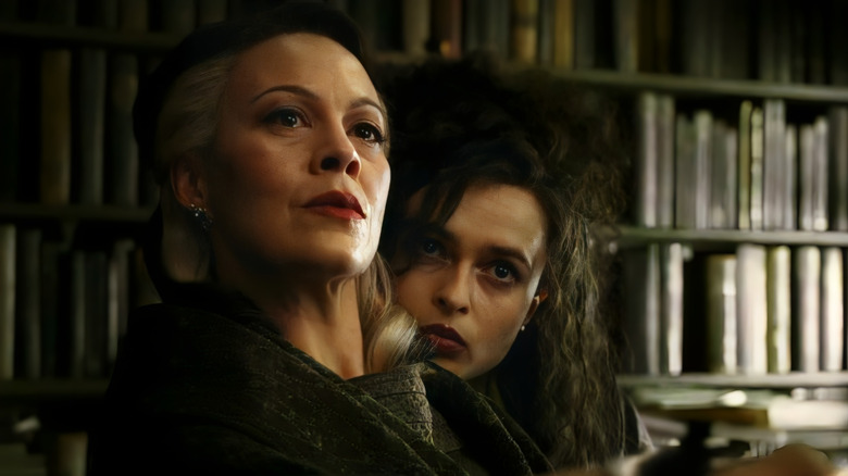 Bellatrix Lestrange peeking behind Narcissa Malfoy in Harry Potter and the Half-Blood Prince