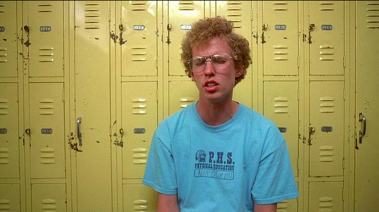 Napoleon sits in front of the gym lockers