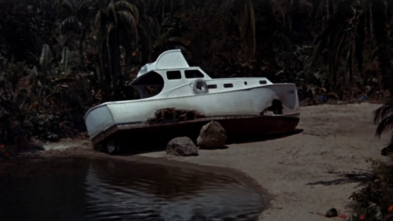 The S S Minnow is seen stranded on the shore of Gilligan's Island