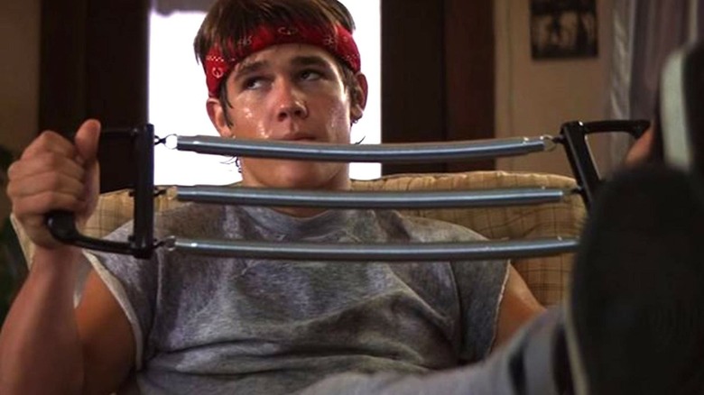 Josh Brolin as Brand Walsh looking exasperated while working out in The Goonies