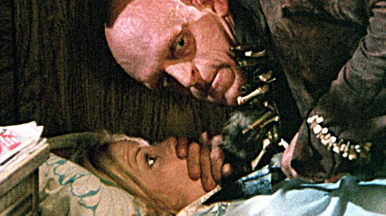 Pluto attacks woman in The Hills Have Eyes (1977)