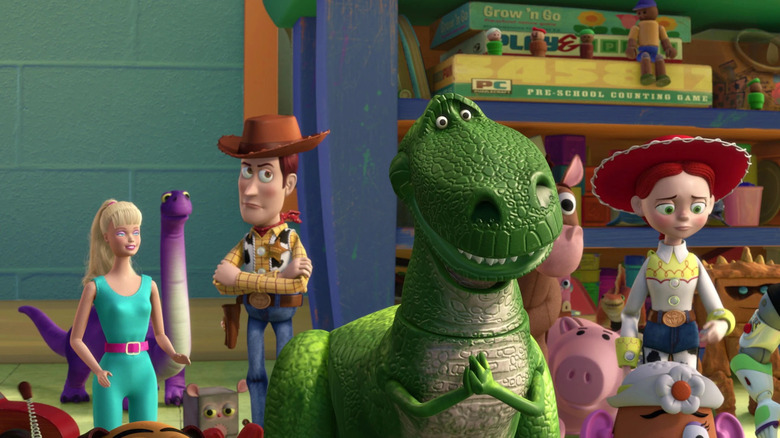 Woody, Rex, Jesse, and other toys, all looking concerned in a group shot from Toy Story 3.