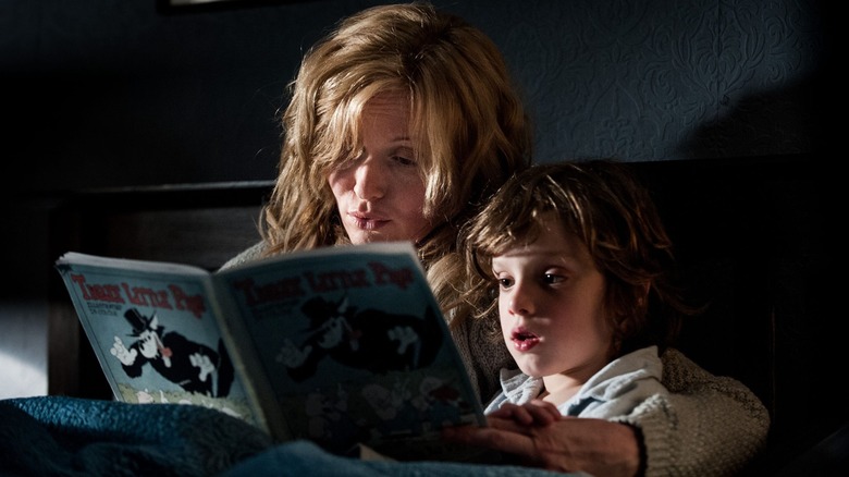 Amelia and her son Samuel read together in Babaduk