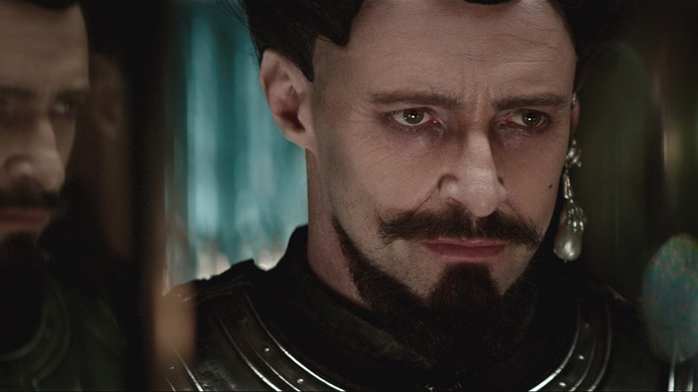 Hugh Jackman's Blackbeard stares moodily at his reflection in Pan