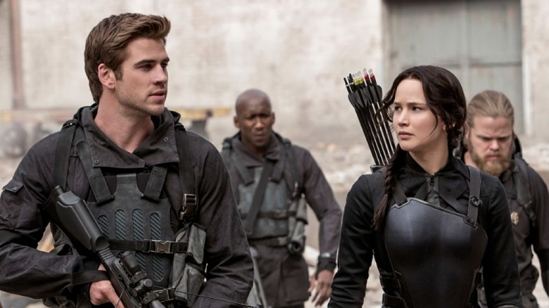 Katniss and Gale wearing armor
