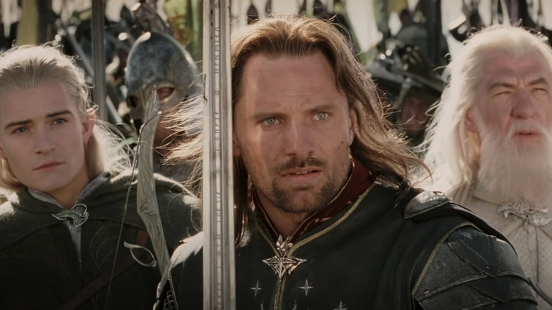 Legolas, Aragorn, and Gandalf in front of an army in The Two Towers