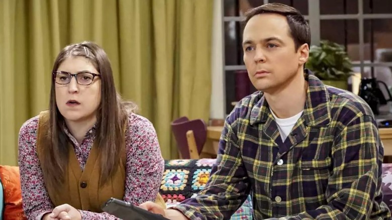 Amy and Sheldon watching something intently on The Big Bang Theory