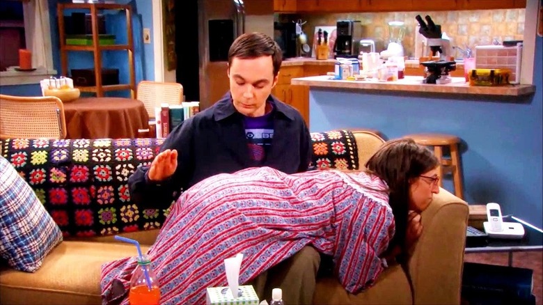 Sheldon spanking Penny on the couch on The Big Bang Theory