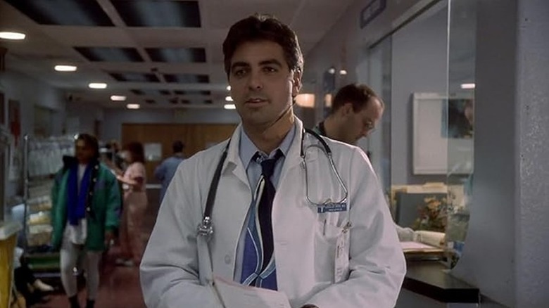 George Clooney as Doug Ross standing in the hallway in ER Season 1