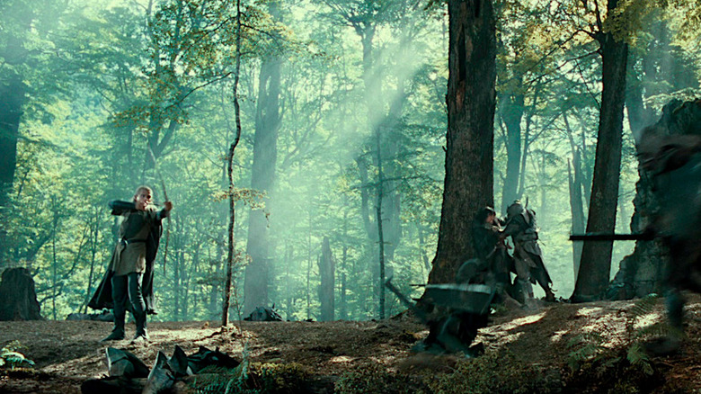 Legolas shoots Orcs with his bow and arrow