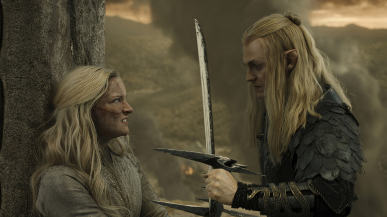 Morfydd Clark as Galadriel and Charlie Vickers as Sauron dueling each other in the Lord of the Rings: The Rings of Power Season 2 finale