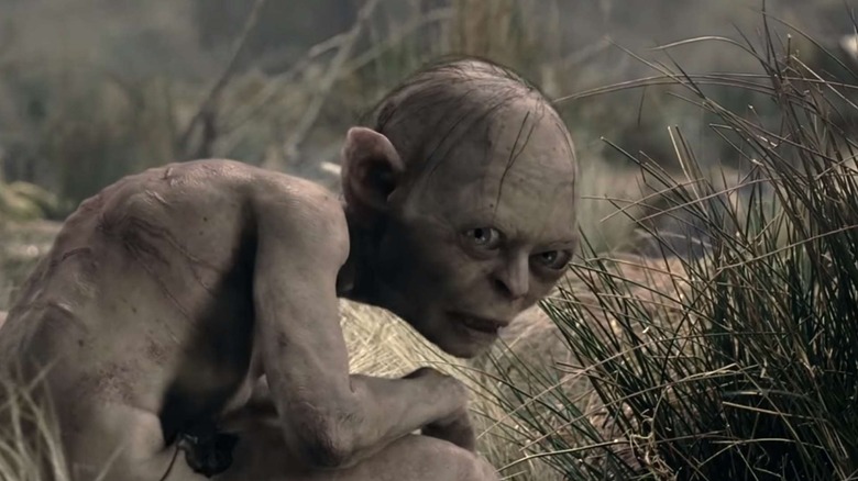 Golum squatting in the grass in the lord of the rings