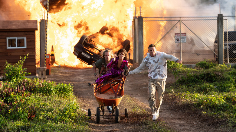 The Lost City cast fleeing a giant explosion