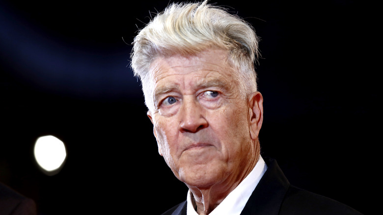 David Lynch in front of a black background