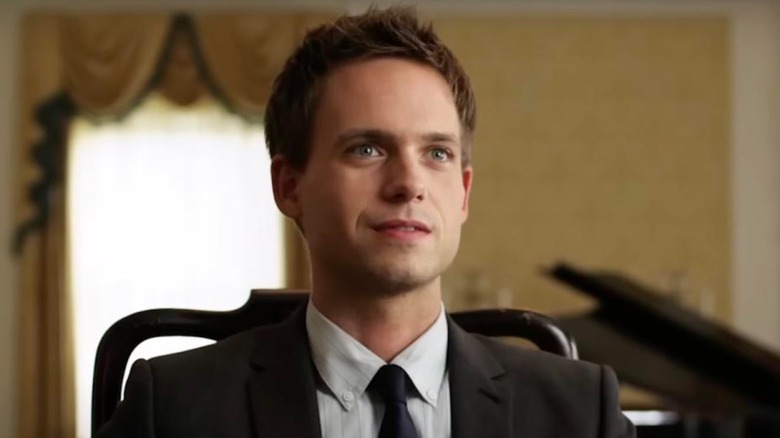 Patrick J. Adams' Mike sits in a chair looking eager in Suits