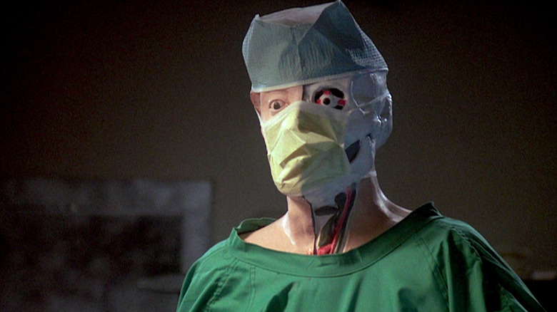 Dr. Hill disguised as a person with an attached head in "Re-Animator"