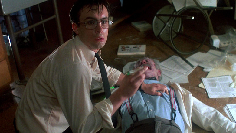 Herbert West injects a body with reagent in "Re-Animator"