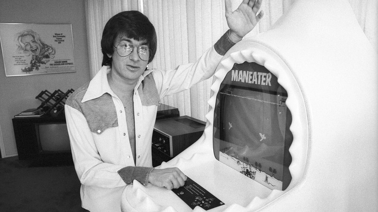 Steven Spielberg with a Maneater video game at his Universal Bungalow in 1975