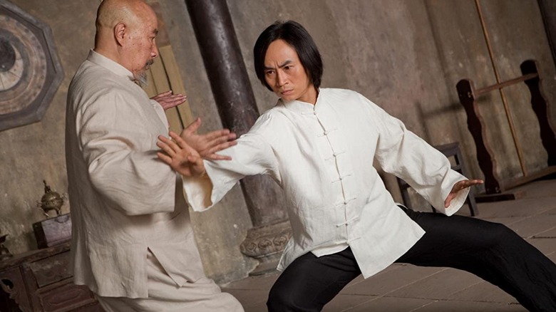 Tiger Chen, training in a martial arts school with an older teacher. He looks very serious about it.