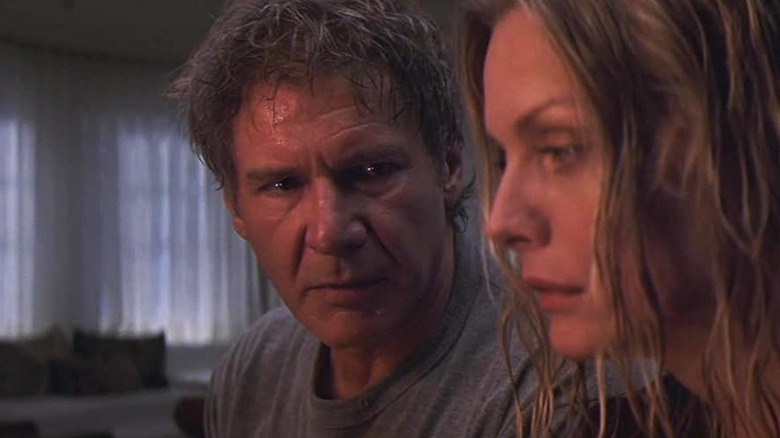 Harrison Ford in the role of Norman Spencer, who looks at Michel Pfeifer as Claire Spencer in what lies below