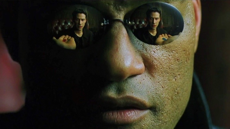 Morpheus offering Neo the red and blue pills