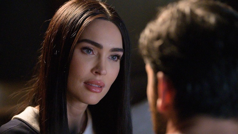 Megan Fox as Alice staring intently in Subservience