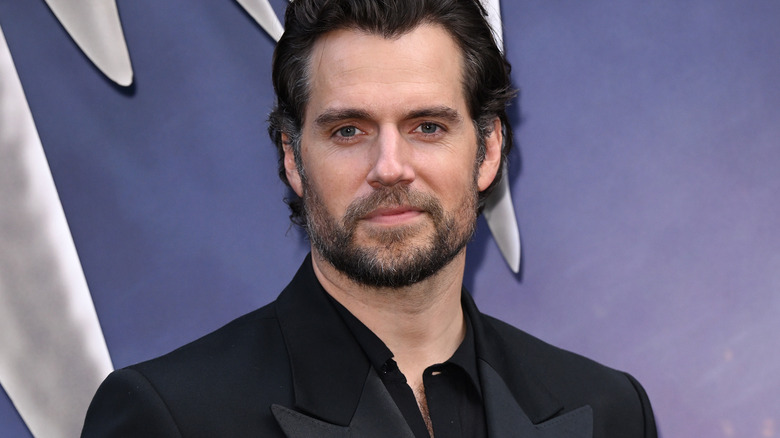 Henry Cavill smiles in close-up at a red carpet event