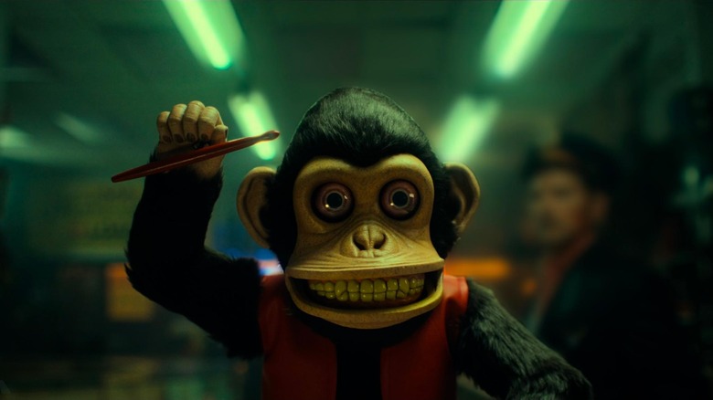 The eponymous windup toy monkey in a scene from The Monkey