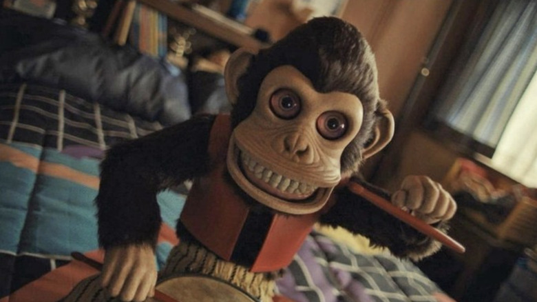 The monkey is ready to make its impression of Neil Part in the monkey