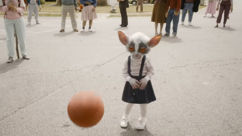 Counter-Earth little girl playing with ball