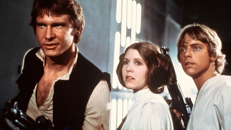 Han, Leia, and Luke, armed in Death Star corridor