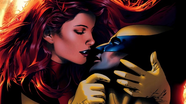 Jean Grey and Wolverine embrace in costume