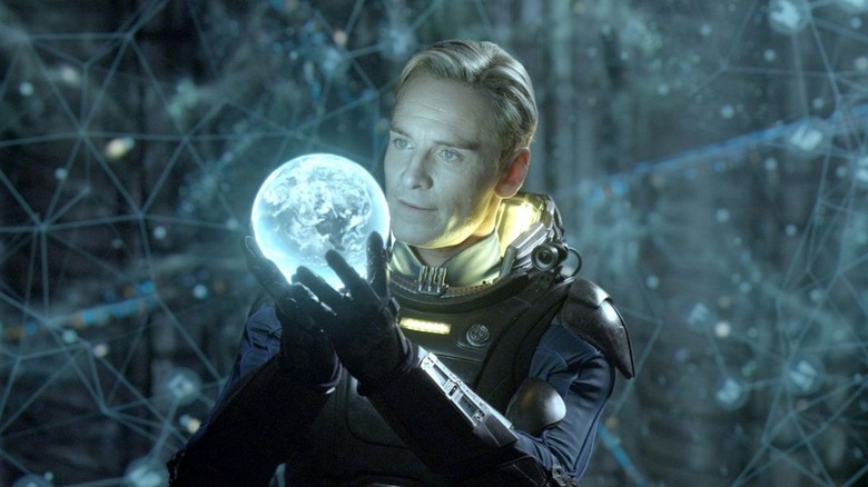 Michael Fassbender holds orb