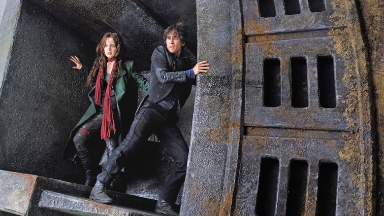 Hera Hilmar and Robert Sheehan making an escape