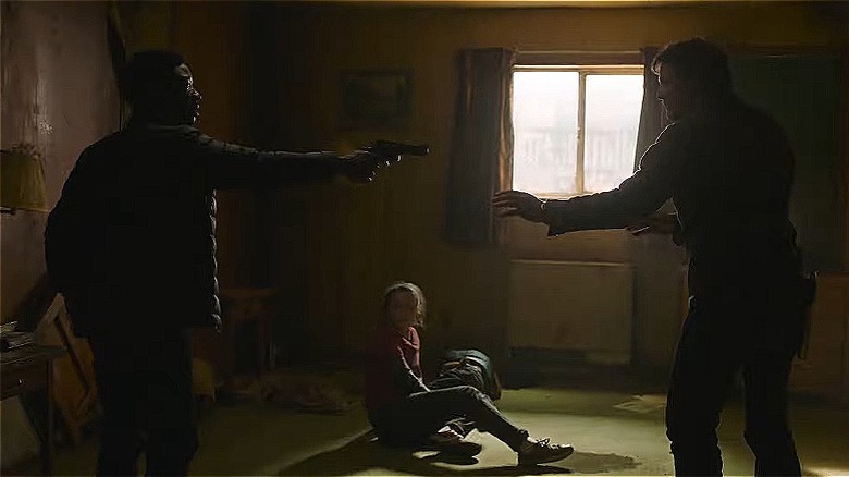 Henry holds gun on Joel