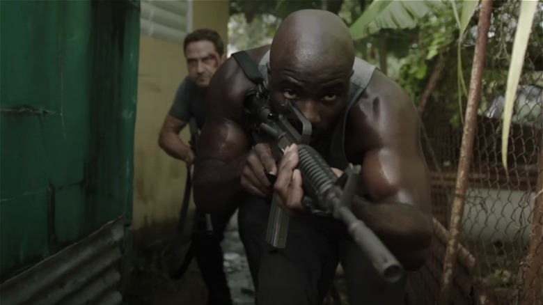 Brodie Torrance and Louis Gaspare running with guns