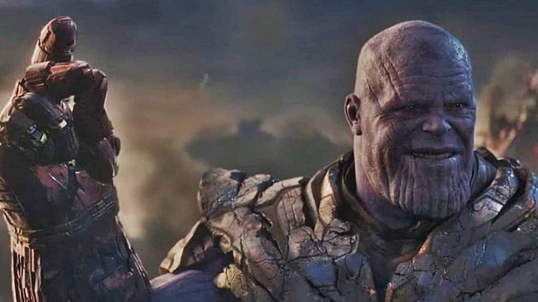 Thanos wearing Infinity Gauntlet and laughing