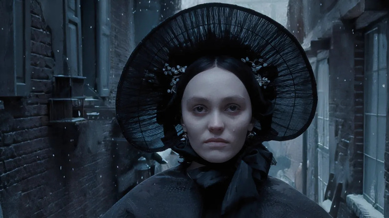 Lily-Rose Depp's Ellen Hutter wearing a wide-brimmed black hat in Nosferatu