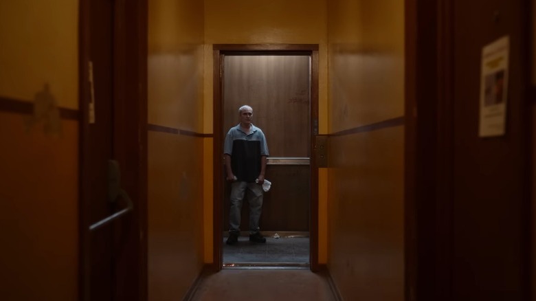 Beau Wassermann in an elevator staring down a hallway in Beau is Afraid