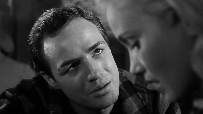 Marlon Brando as Terry gives Eva Marie Saint as Edie a curious look in On the Waterfront