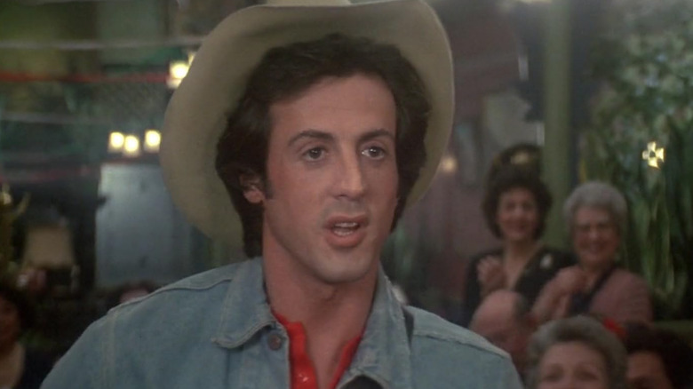 Nick (Sylvester Stallone) in a cowboy hat in a honky-tonk bar in Rhinestone.