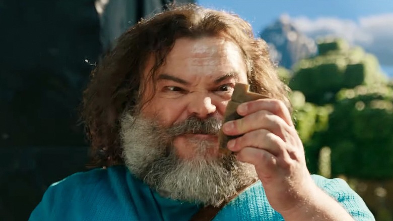 Jack Black's Steve uses a flint and steel in A Minecraft Movie