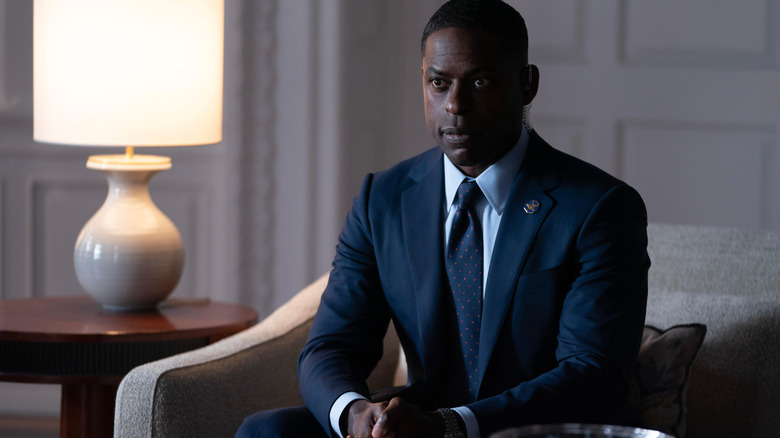 Sterling K. Brown as Agent Collins staring attentively while sitting down in Paradise