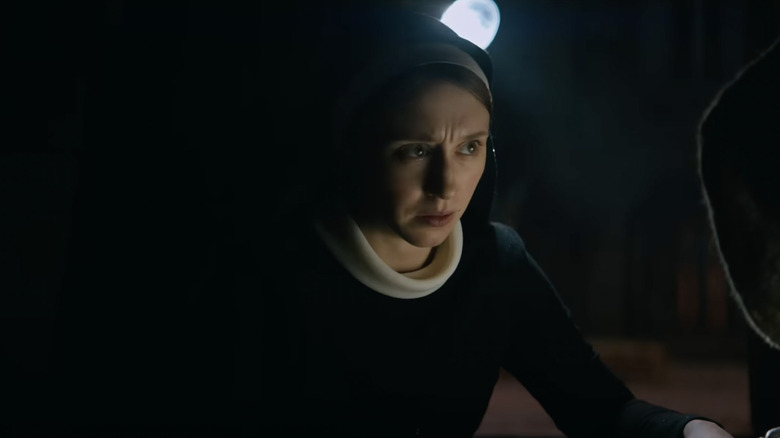 Taissa Farmiga looking concerned